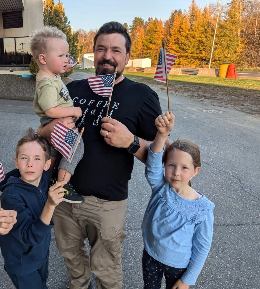 Brotherhood Coffee family celebrating with American flags